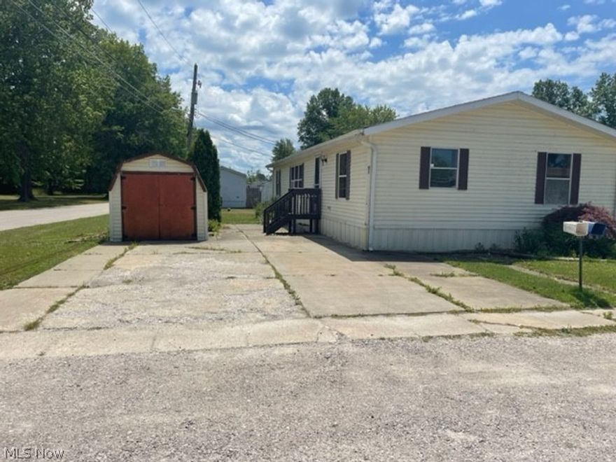 This spacious 1989 double wide has 3 bedrooms and 2 full bathrooms. Master bedroom with newly remodeled master bath and a walk in closet.  Nice open kitchen with skylight for tons of natural light and a breakfast/bar seating area that opens up into the large dining room. Large laundry/utility room with extra storage space. Great location close to the 'strip' at GOTL and the shores of Lake Erie. Call to schedule your showing today!!