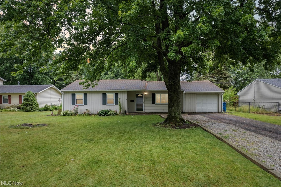 Home Sweet Home! This very charming 3 bedroom ranch is situated on a beautiful quarter acre lot that backs to city owned property, woods and farmland. Desirable location of North Ridgeville. Just across the road from North Ridgeville Academic Center and North Ridgeville High School. Everything is close by including major highways 480 and turnpike, shopping, dining, parks, recreation! This is one floor living at its finest! The spacious living room opens to the kitchen and dining room. Beautiful vinyl flooring flows throughout. Glass sliding door in the dining room overlooks the backyard. Kitchen features updated cabinetry with modern hardware and colors, attractive tile flooring and custom wood pallet wall. Off the kitchen is a nice flex room that connects to the attached garage - could easily dual as a mudroom and walk in pantry. Down the hall you will find an updated full bathroom and 3 ample bedrooms. You will love the covered back porch; it is the perfect place to entertain and als