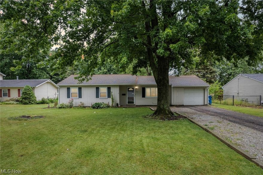 Home Sweet Home! This very charming 3 bedroom ranch is situated on a beautiful quarter acre lot that backs to city owned property, woods and farmland. Desirable location of North Ridgeville. Just across the road from North Ridgeville Academic Center and North Ridgeville High School. Everything is close by including major highways 480 and turnpike, shopping, dining, parks, recreation! This is one floor living at its finest! The spacious living room opens to the kitchen and dining room. Beautiful vinyl flooring flows throughout. Glass sliding door in the dining room overlooks the backyard. Kitchen features updated cabinetry with modern hardware and colors, attractive tile flooring and custom wood pallet wall. Off the kitchen is a nice flex room that connects to the attached garage - could easily dual as a mudroom and walk in pantry. Down the hall you will find an updated full bathroom and 3 ample bedrooms. You will love the covered back porch; it is the perfect place to entertain and als