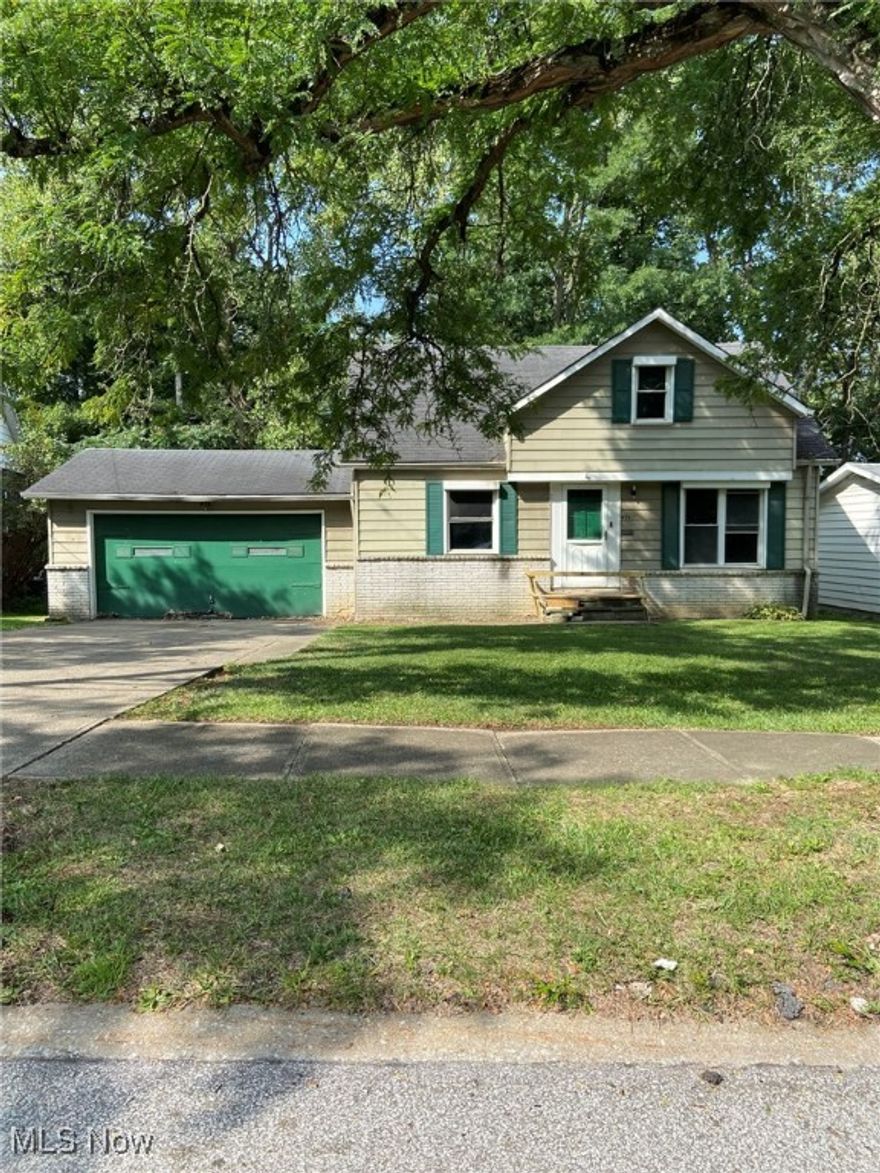 Garfield Heights Three Bedroom Cape Cod with Attached 2 Car Garage! Nice Size Kitchen! First Floor Features Original Hardwood Floors! Two Bedrooms and Full Bath Located on First Floor. Third Bedroom on Second Floor offers Loads of Storage Space. Unfinished Basement. Large Backyard! This is a Fannie Mae HomePath Property.