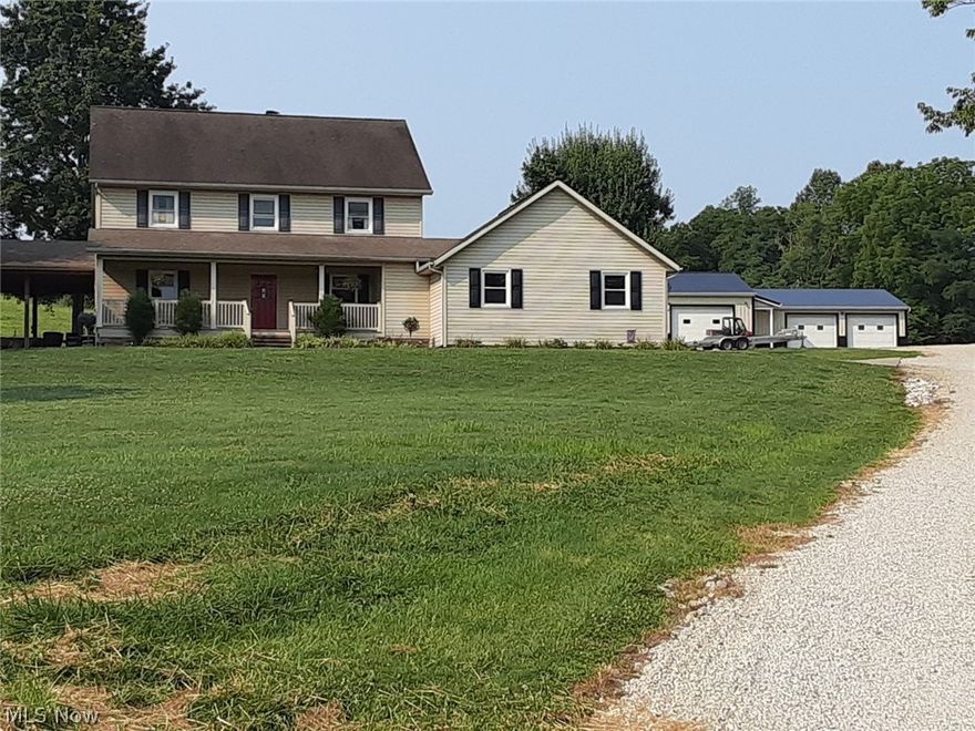 Enjoy country living and country views from the covered front porch or the covered patio, both overlooking the neighbors pond. Attached 2 car garage and detached 3.5 car garage with equipment storage area. Beautiful kitchen, main level laundry and amazing oversized baths.