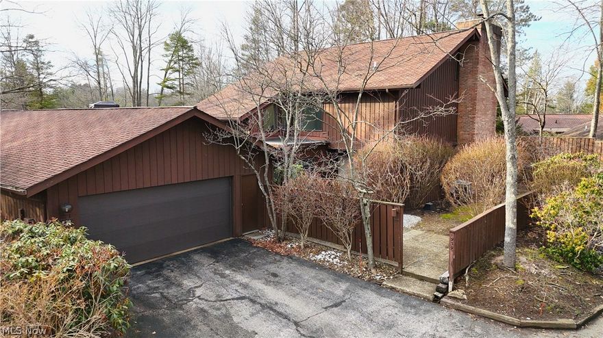 Welcome to a rare opportunity in Kent- a spacious and airy 3-bedroom, 2.5-bath townhome offering over 2,200 square feet of living space in a peaceful, wooded setting.
Tucked away on Pine Drive, this home welcomes you through a private courtyard entry into a bright and open main level designed for comfortable living and entertaining. The living, dining, and kitchen areas flow seamlessly together, highlighted by vaulted ceilings, skylights, and a stunning wall of sliding glass doors that bring in loads of natural light and connect the indoors to the surrounding nature.
The main living area features a cozy wood-burning fireplace, while newer flooring and neutral finishes create a clean, move-in-ready feel throughout. The kitchen offers white cabinetry, granite countertops, tile backsplash, and coordinating appliances, along with easy access to the formal dining space and outdoor courtyard-perfect for morning coffee or evening relaxation.
Upstairs, you’ll find three generously sized bedrooms, which feature vaulted ceilings and skylights that enhance the airy feel of the home. The primary suite is a true retreat, complete with its own fireplace, walk-in closet, and private en suite bath with walk-in shower.
Additional highlights include a large family room with wet bar, convenient first-floor laundry, abundant storage throughout, and an oversized attached two-car garage (over 575 sq ft). 
With its size, unique layout, and serene setting, opportunities like this rarely become available in Kent. Conveniently located near downtown, Kent State University, parks, dining, and shopping & more. This home truly offers the perfect blend of privacy and accessibility. Schedule your private tour TODAY!