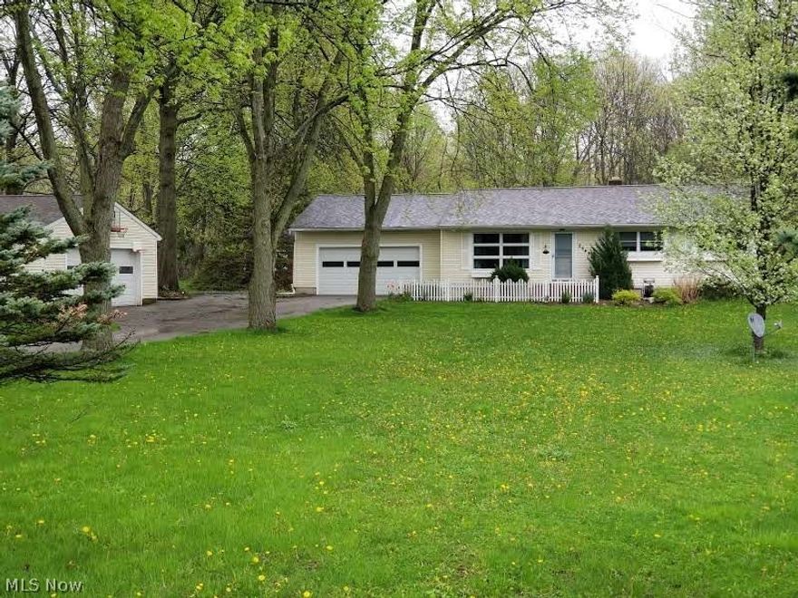 This 3 bedroom 2 full bath ranch located in Richfield is waiting for you to make it your home. This home sits on just over a acre and has attached 2 car garage and 2 car detached garage plus a L shaped barn with double door entry and electric. Eat in Kitchen with all appliances staying, newer floor and pantry.  Newer windows throughout. Finished basement with rec room, laundry room and full bath. Plenty of storage in this home as well. Cement patio in rear. Revere Schools!