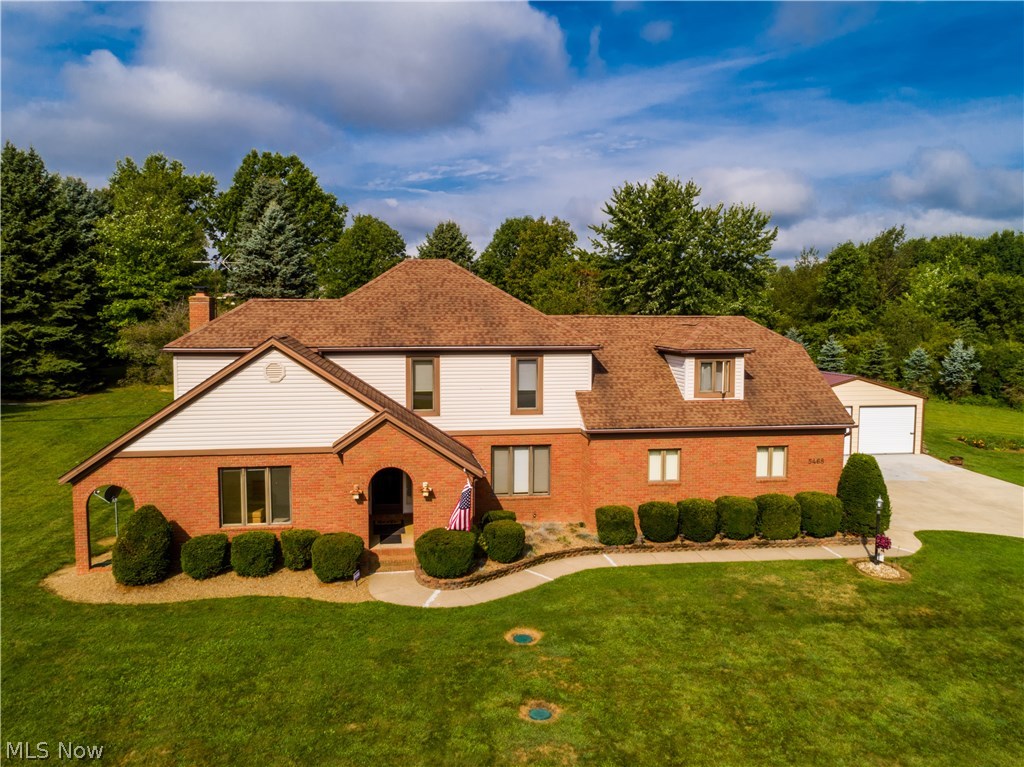 Sitting on 2.34 acres is this beautiful Tudor with 4 bedrooms & 2 full baths with 2674 SF* Upon entering through the vaulted brick front porch with a fan is the open foyer with ceramic floors & view of the oak staircase* 1st floor includes the light & bright dining room with chair rail & crown molding & the den with crown molding* Great room boasts a wood floor, fan, floor to ceiling stone fireplace gas log fireplace, double crown & access to back patio which leads to a mini outbuilding/storage house with windows & electric* The applianced eat in kitchen includes a bayed eating area, ceramic floor, rollout shelves, oak cabinets, ceramic back splash, island with burner top, built in desk & walk in pantry* Full bath off of kitchen* Two separate staircases can lead you to the second level which includes the master bedroom with 2 fans, dormer & private access to bath* Bedroom #2 (which was a master bedroom) has 2 closets w/mirrors, fan, built in desk which can be a vanity* Bedrooms 3 & 4 b
