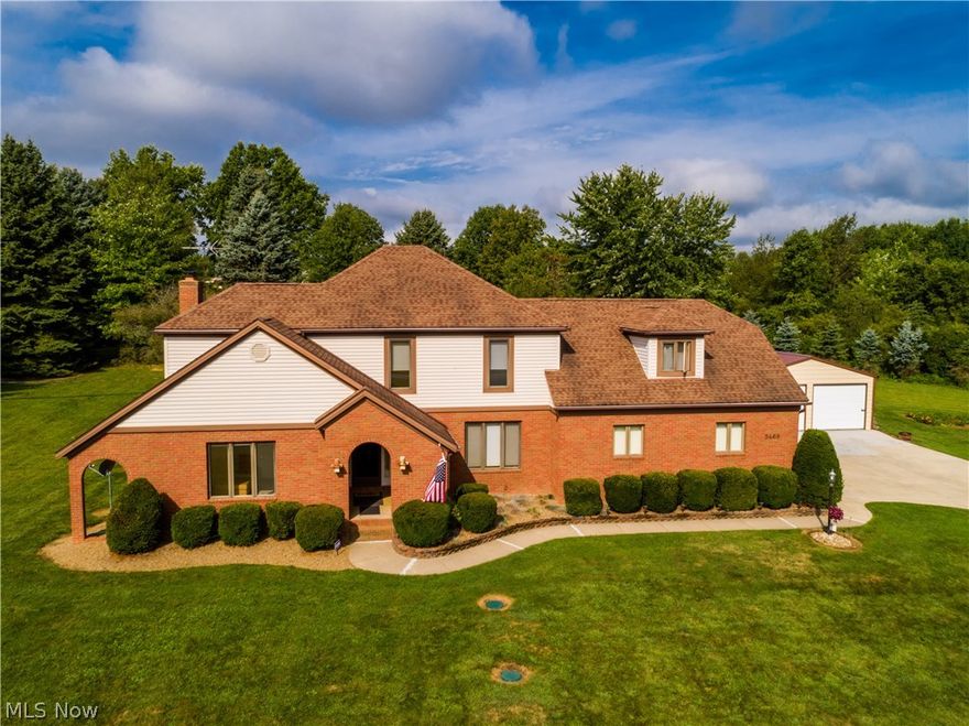 Sitting on 2.34 acres is this beautiful Tudor with 4 bedrooms & 2 full baths with 2674 SF* Upon entering through the vaulted brick front porch with a fan is the open foyer with ceramic floors & view of the oak staircase* 1st floor includes the light & bright dining room with chair rail & crown molding & the den with crown molding* Great room boasts a wood floor, fan, floor to ceiling stone fireplace gas log fireplace, double crown & access to back patio which leads to a mini outbuilding/storage house with windows & electric* The applianced eat in kitchen includes a bayed eating area, ceramic floor, rollout shelves, oak cabinets, ceramic back splash, island with burner top, built in desk & walk in pantry* Full bath off of kitchen* Two separate staircases can lead you to the second level which includes the master bedroom with 2 fans, dormer & private access to bath* Bedroom #2 (which was a master bedroom) has 2 closets w/mirrors, fan, built in desk which can be a vanity* Bedrooms 3 & 4 b