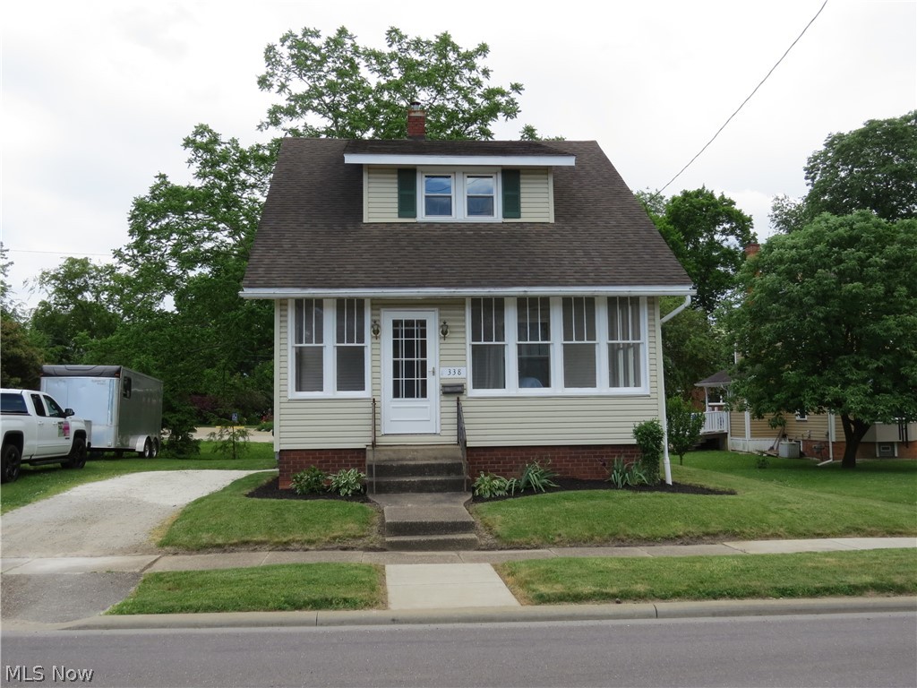Charming 2 Story Bungalow in Carrollton! Move-in-ready 2-bath, 2-bedroom home located within a short walk to restaurants, groceries, schools, parks, etc. Home has great street appeal with a glass-widow enclosed front porch for visiting or growing plants, and dormers which bring out the character of the home. An easy to maintain level lot with gravel parking area. Inside you'll discover bright, well-lit rooms provided with natural light from replacement windows, high ceilings, yellow pine natural woodwork, and a first-floor bath/ laundry. Each bedroom upstairs has a walk-in closet or potential of one. An adjacent room to one bedroom could also make be nursery or reading room. The basement has plenty of room for extra storage or even workshop area with good ceiling height. Lots of updates including furnace, AC, windows, etc. Annual taxes without the Homestead Reduction would be $1551. Look this one over and see how it fits your lifestyle! Call to schedule your viewing today!