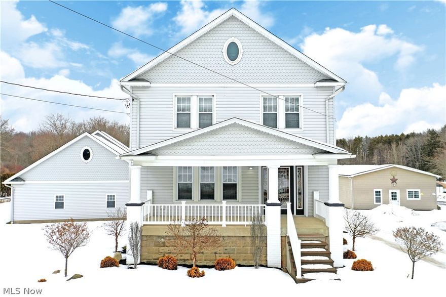 Three floors of gorgeous, modern styling and a must-see outbuilding await this surprise filled Brookfield home! Expect the unexpected as you traverse the meticulously crafted living space of this towering residence. Each floor brings stunning, contemporary design and elegance to create a truly unique package. A covered front porch leads you into the formal entry while side and basement walk-out entrances are also available off the substantial drive. Inside, soothing gray and white color schemes work masterfully with the dark, cool gray flooring. A tile trimmed fireplace awaits the far wall as surround sound entertainment joins recessed lighting at the top corners of the room. A central kitchen explodes in stainless and accenting tile work with its basin sink and slick, granite countertops. Shiplap style graces the cabinets that continue into the nearby first-floor laundry and lavish custom full bath with glass door shower. The engaging dining room completes the floor with a sitting led