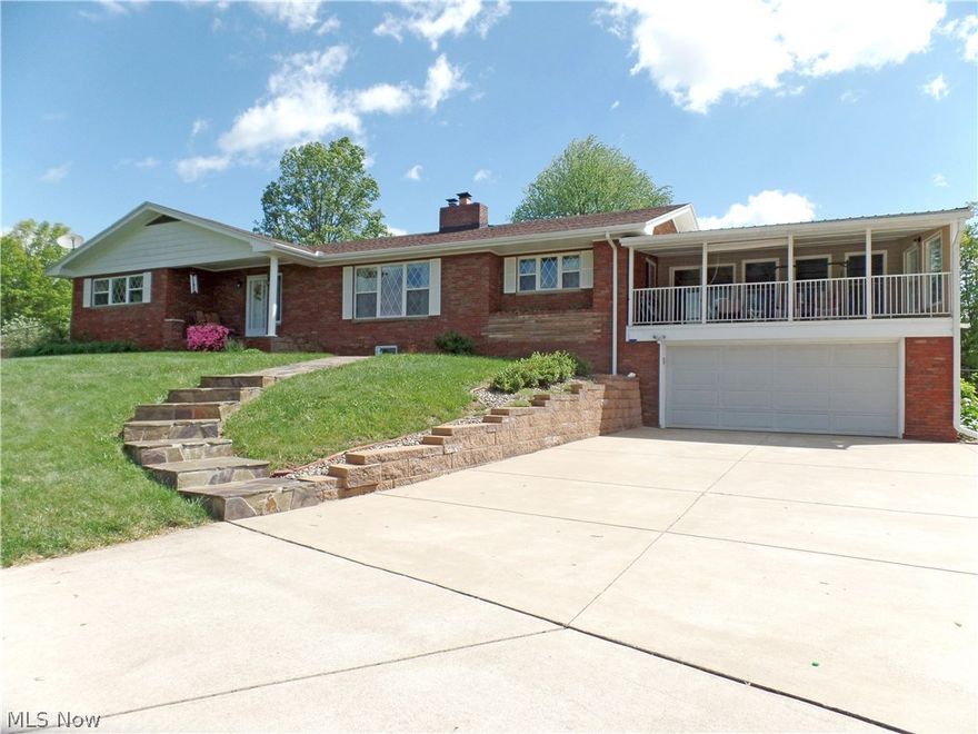 This immaculate and well maintained brick ranch is beautiful in every way!  It offers gorgeous hardwood floors, spacious and updated eat-in kitchen, formal dining room, large formal living room with fireplace creating a relaxing atmosphere as well as an inviting 20x20 sun porch with vaulted ceiling and stunning views.  The lower level has a large rec room, mud room and an abundance of storage.  There are three decks, fenced backyard pretty landscaping and storage building with electric.  This home has fantastic curb appeal and sits beautifully on 1.5 acres.