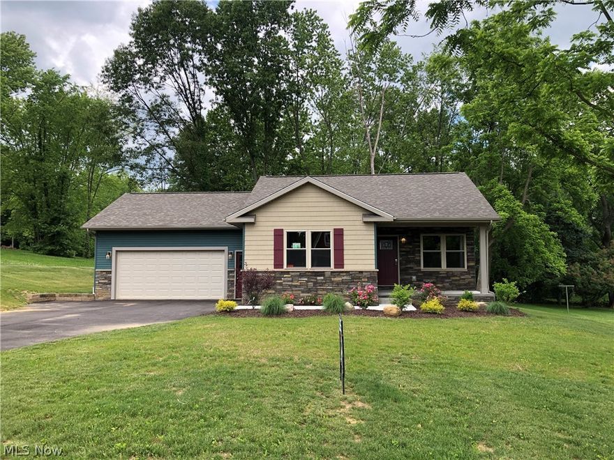 New Construction ranch home in Jackson Twp with private back yard with mature trees that is entering its final stages of completion. Enter into the open great room with vaulted ceilings and a gas fireplace that opens up to the beautiful kitchen with custom soft-close white kitchen cabinets. Granite countertops and real wood breakfast counter along with full appliance package that completes this beautiful kitchen. Great room and kitchen boast hardwood floors. The master bedroom suite is filled with natural light and the master bathroom has a large walk-in shower, vanity with granite countertops and dual vessel bowl sinks. The second bedroom is separated from the master and offers privacy. The home has a full lower level with 9-foot ceiling heights and an additional 600 Sq Ft of living space, perfect for a large family room, recreation area, or home gym. The lower level also includes a half bath, the high-end Pex plumbing system and vented glass block windows. Laundry room includes a lau