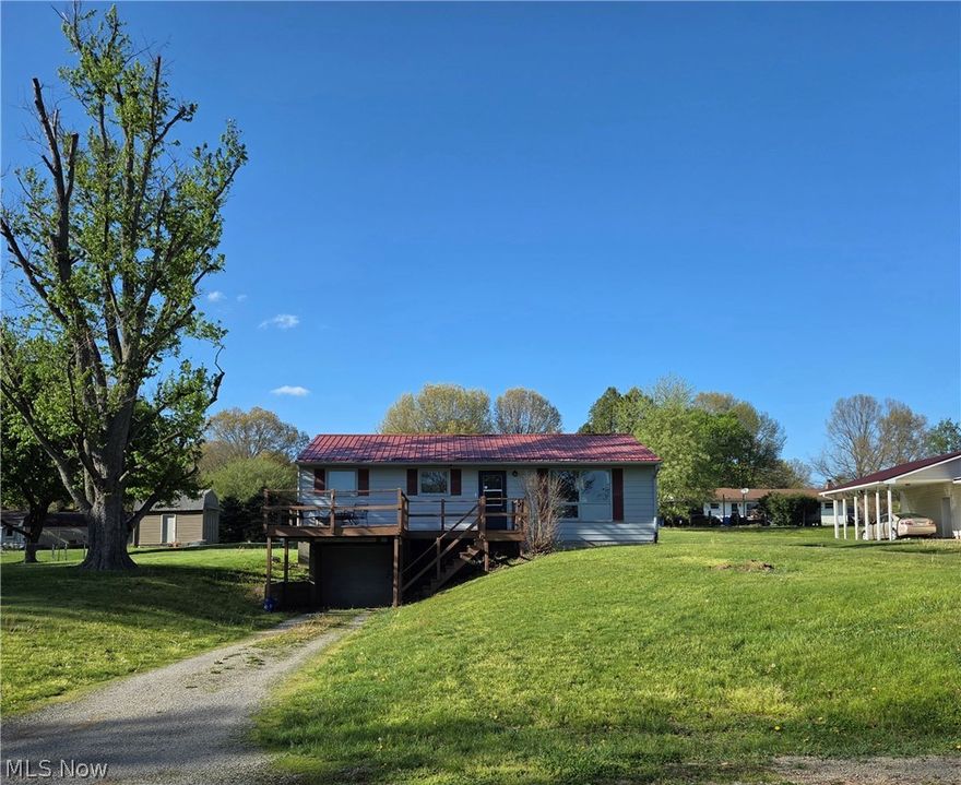 What a great opportunity to enjoy making this lovely ranch home your own! The prime location is well worth the renovations this home needs. On just under half an acre near the end of a quiet street, it is also near the entrance to the gorgeous Southside Community Park with sports fields, walking trails, a dog park, and much more! The view from the front deck of this home is of a beautiful, fenced pasture. On just under 1/2 an acre, the large yard offers plenty of space for play and expansion. The main level Living Area is spacious with its open Living Room, Dining Area, and Kitchen that could be a blank canvas for your personal touch. Down the hall you'll find a Full Bathroom, and three cozy Bedrooms. The Lower Level of this home offers the opportunity for more living space. There is a large space perfect for a Rec Room, and a Utility Room with Laundry hookups. In addition, you'll find the oversized one car Garage for parking out of the elements, and extra space for storage. Existing updates include: Newer metal roof; newer septic baffle. Priced to allow for modern updates, this home could be your opportunity for an investment in the future. Live Abundantly in this ideal location for your dream home!