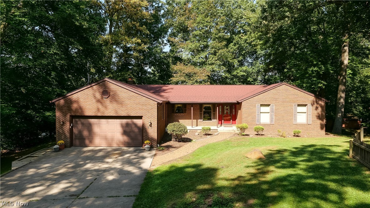 Immaculate well maintained 3 bedroom 3 1/2 bath all brick ranch on a .62 acre private wooded lot. The covered front porch leads into the front entry foyer. Beautiful oak trim throughout. Hardwood floors in the living room and formal dining room. The spacious eat in kitchen has ample cabinet and counter top space. All appliances stay. The family room is off of the kitchen and features a gas fireplace and a slider to the sunroom. The 1st floor laundry room includes a half bath and entry to the lower level and the 2 car attached garage. Washer and dryer are included. On the other side of the main floor is the master suite which has a full bath with a jetted tub and separate shower as well as a walk in closet. 2 more bedrooms and a shared full bath complete the main floor. The spacious basement includes a carpeted rec room with high quality wood paneling, a custom built bar, full bath, a workshop, and large storage closets. The wooded backyard has a large deck off of the sunroom, a gazebo,