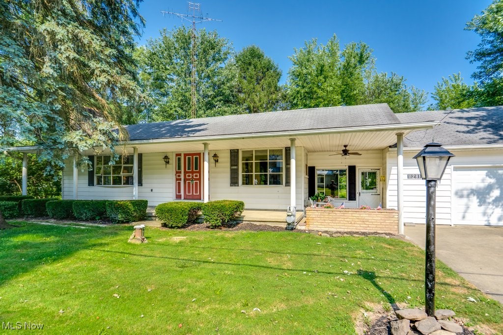 Get comfy and cozy in Kensington at 11281 St. Rt. 9! This well-loved ranch home is ready for you! From the large living room with a beautiful stone fireplace to the kitchen and dinette, then you can head to the 3 bedrooms, 1 full and 1 half bath, basement with another fireplace and more! As if that isn't enough, there is a 4-Season room that leads out to a beautiful and spacious back porch. From there, you can overlook the well sized yard! Entertaining would be great here. There is an oversized 2.5 car attached garage adding more value to an already great home. The Sellers just had a brand new furnace installed too! This home was recently hooked up to city sewer. The well is also newer! Gas heat! There is a front porch for even more relaxation in a quiet location. In under thirty minutes you can be in Carrollton, Salem, Alliance, or Lisbon and only 40 minutes to Canton. Out in a gorgeous country setting with all of the benefits of town! This home is perfect for so many family situations. From first home to downsizing, and everything in between, it has all you need. The best part is that it is priced right! Don't blink or you will miss it!
