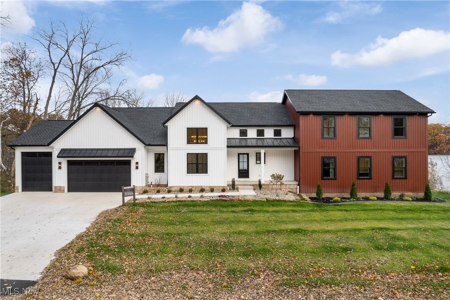 Stunning newly built lakefront retreat with a first-floor master suite, offering serene water views. This modern
masterpiece boasts an open-concept design with soaring 14' ceilings, gourmet kitchen featuring upgraded appliances, and
expansive windows flooding the space with natural light. The first-floor master is a private oasis with an oversized all-tile
shower, relaxing tub, and a spacious walk-in closet. Additional highlights include high-end finishes, an all stone fireplace,
a versatile office space, and finished area in the basement with a full bathroom. Enjoy outdoor living with a private screened back deck leading to an open deck extending to the water, ideal for boating or unwinding. This energy-efficient lakefront gem offers the ultimate blend of elegance and comfort.