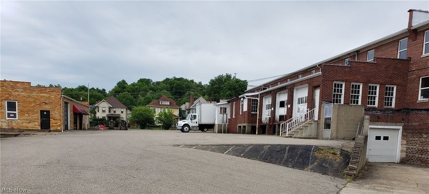 2.80 acres, on a high traffic corner lot. Many updates since being built.  Lots of rooftops. The subject property has been very well maintained, and considerable improvements in design and layouts interior and exterior.  Square footage of  84,964 sq. ft. with 10' to 20'  ceiling height. Consists of 3 bldgs. 3,550 sq. ft. now set up offices. Freight Elevator. The subject is less than a 1-mile NW of I-77. Ingress and egress on both main highways with multiple curb cuts.   The property is enclosed with a chain-link fence. The property has a total of 778 ft. of road frontage with glass showroom windows. Land uses in the subject neighborhood consist of light industrial development, retail, and residential uses.