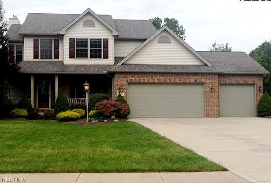 This colonial was custom built and features brick fireplace, ceramic floor in kitchen & foyer, hardwood floor & tray ceiling in formal dining room and many other upgrades. Master suite with vaulted ceiling and soaking tub w/ separate shower in master bath. 1st floor laundry room w/cabinets, dramatic 2 story foyer and a full basement. Add to all this the 3 car garage, wrap around front porch and 2 tiered stamped concrete patio off the rear overlooking big yard & you've got a must see home! Roof is 4 years old