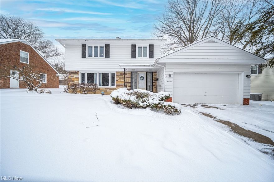 Welcome to this charming home nestled in the heart of Shaker Heights! 1st floor boasts an inviting foyer, which opens into the spacious living room with a picture window offering lots of natural light & a cozy fireplace. The formal dining room overlooks the large privacy fence in the backyard. Spacious eat-in kitchen w/stainless steel appliances and includes a built-in desk. 1st floor also offers an incredible bonus room with vaulted ceilings with wood beams, glass slider and the newer stamped concrete patio which makes the perfect space for family dinners or entertaining.  Other first floor features include a guest bath and a first floor laundry room. Second floor boasts 3 over-sized bedrooms, including a large master bedroom with 3 closets & its own full master bath, a second full bath of the hallway and bonus walk-in storage space with newer insulation over the garage. Lower level offers a large recreation room and tons of storage.  Two car attached garage. Home warranty!