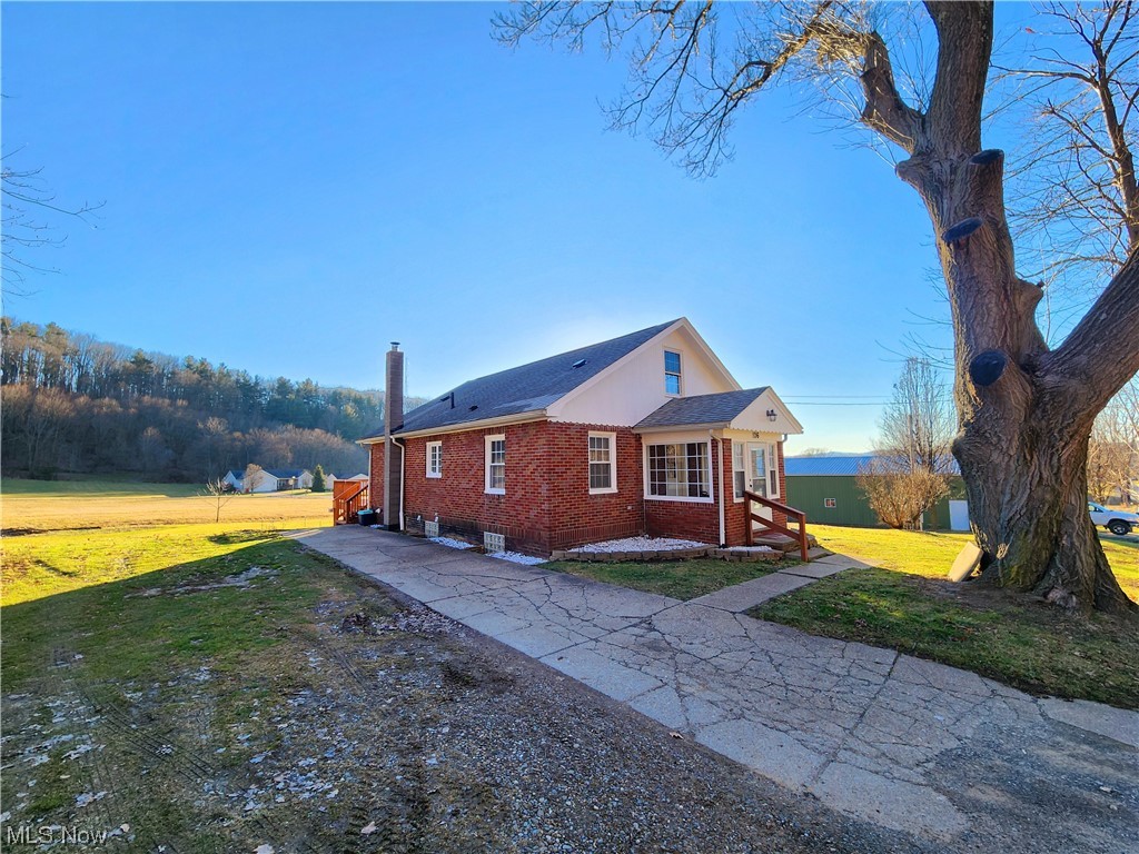 Move in ready, with a Countryside setting! Nestled just outside the village of Minerva, this brick bungalow offers a little something for everyone. As you pull up the property take notice of the oversized, detached garage with space for all the equipment. Walk through the front porch into the family room, with new vinyl flooring. From there take notice of the eat in kitchen. The main floor also offers 2 bedrooms, a full bath, and its own pantry room. Before making your way to the basement, take a tour of the upstairs master suite, with its own half bath. From there, head down to fully finished, and walkout basement to see all the space for possibilities. Equipped with another full bath, and laundry, there is also an additional three rooms for you to decide how to use. Finally make your way back upstairs to step out on the back deck and take in all the country view surrounding.