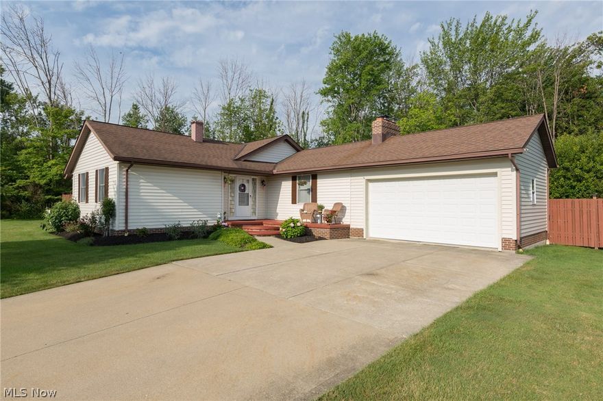 Just waiting for you to call it home.  This fabulous ranch sets atop an elevated wooded lot among an area of newer homes.  You are welcomed into this updated home through an inviting foyer.  The foyer opens to a large family room that features a wood burning fireplace and Pergo flooring.  The home is accented by a full wall  of natural light coming in from the west.  Ladies will love the modern kitchen with  granite counter tops, cherry cabinets, strip accent light, many newer appliances and Jenn-Air cook top.  A first floor laundry is near the kitchen for added convenience.  All bedrooms are good size and have low maintenance laminate floors.  The main bath offers  a large 36 x 72 two person heated whirlpool tub for cozy nights. The basement is partially finished with an office or extra bedroom and full bath.  Guys will like the storage this basement has.  You have to see it.  This home has a park like setting that abuts a one acre green space that is shared with the neighbors.