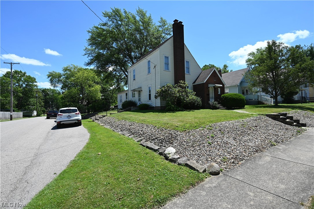 Charming home on a corner lot. The first floor consists of a large living room with a brick fireplace, an eat-in kitchen, two bedrooms, a full bathroom, a laundry/mud room, and a foyer with a walk-in coat closet. The second floor has two bedrooms, a full bathroom, and a T.V. room. The attached one-car garage is located in the basement. The backyard ends at the back alley, and the shed goes with the property. Enjoy the covered patio overlooking the backyard. Bath Fitters recently installed the first-floor shower.