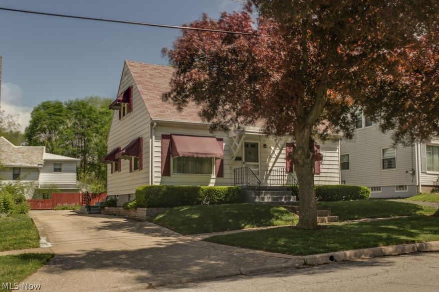 Spotless and wonderfully maintained cape. Prideful one owner home! Beautiful white kitchen. Spacious 2nd Floor Bedroom features large closets and built-in storage. Replacement windows throughout home.  Partially finished basement adds an additional approximate 300 square feet of living area, featuring a Rec Room and full second Kitchen! In addition is the basement workshop area with workbench and laundry area.   Steel siding and beautiful window awnings. Well manicured yard with concrete driveway and oversized detached one-car garage with workbench.  One year home warranty provided with sale.