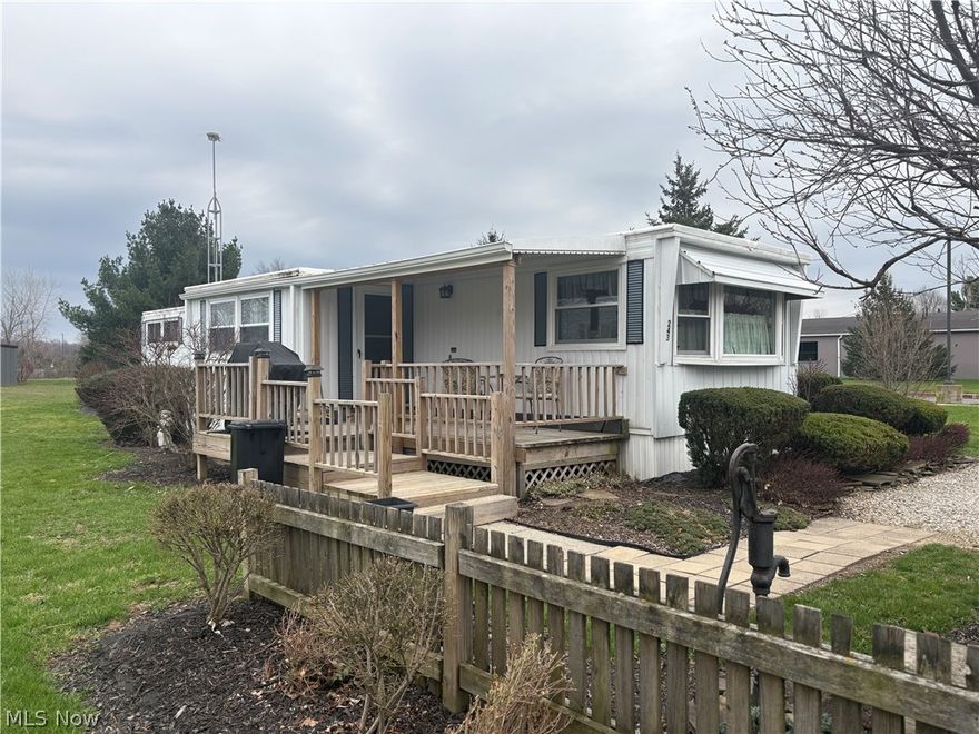 Adorable 2 bedroom,1 bath mobile home with vintage style and modern amenities! Completely move in ready! Nice gravel driveway with plenty of space for multiple cars. Welcoming porch, perfect for morning coffee or relaxing evenings! Large living room with wood accent wall. Fully applianced, eat in kitchen! Primary bedroom with large closet! Newer windows let in lots of natural light. 2 sheds provide plenty of additional storage space! Beautiful landscaping on a large lot! Great location within walking distance of New London schools! Ideal for anyone looking for low maintenance, affordable living! Would also make a great investment property!