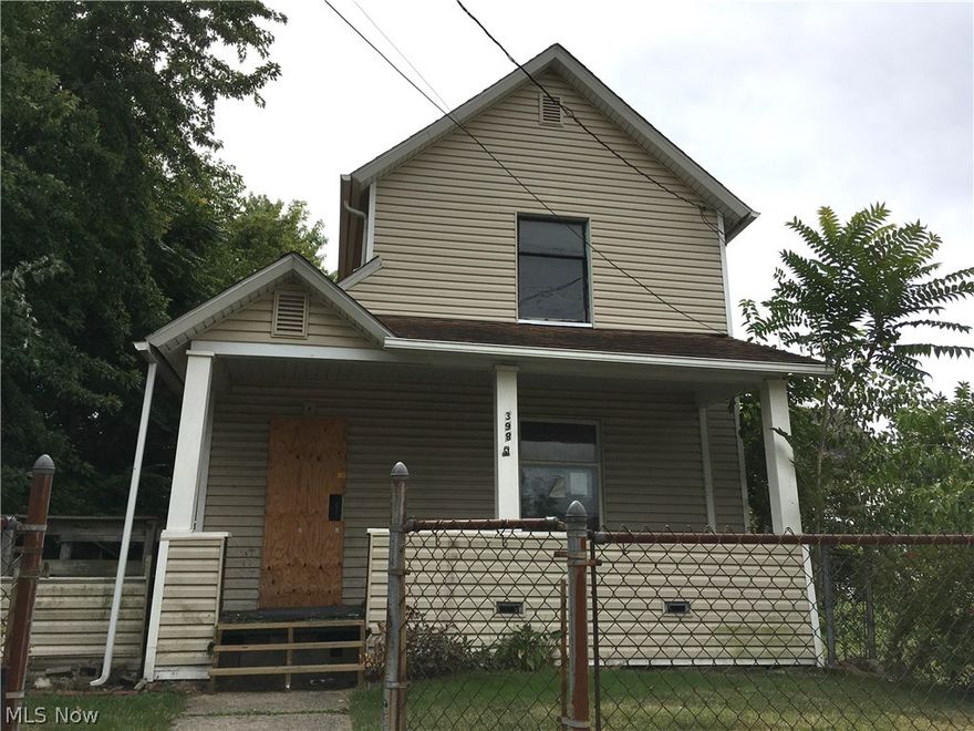 Vinyl sided house with large front porch, fenced yard, handicap ramp.  2 bedroom on second floor, large rooms on first floor, enclosed porch.