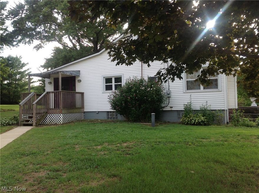 A must to see! Larger than it looks. Up to 4 bdrms (2 on first floor). Beautiful forming dining room with wood floors. Spacious eat-in kitchen. Wood burner in living room. Two bdrms on 2nd floor with built-ins. Nice clean walk out basement. Some newer windows. Covered porch. Approx. 2.2 acres. Detached 3 car garage. Very nice well kept home in West Branch. Mahoning well and septic inspections complete, seller updating septic per county. All room sizes and sq ft are estimated.