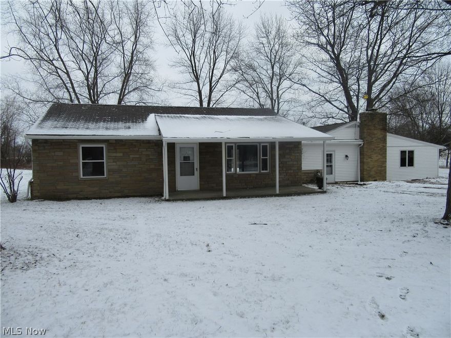 Feel right at home in this newly renovated ranch with an open concept. Walk in the front door to the living room that open to the kitchen and dining room.  A perfect setting to entertain and spend time with your family. The beautiful kitchen boasts subway tile back splash and concrete countertops, a large island separates the kitchen from the living room. The master suite is sure to please with a wood burning fireplace perfect for winter nights. The master bathroom includes a custom tile shower, dual vanity, and large linen closet. Off the master bedroom is a roomy walk in closet and office. Outside you will enjoy the privacy of this great .8 acre lot with a back patio, detached 2 car garage, and big backyard with a creek. Call for a private showing.