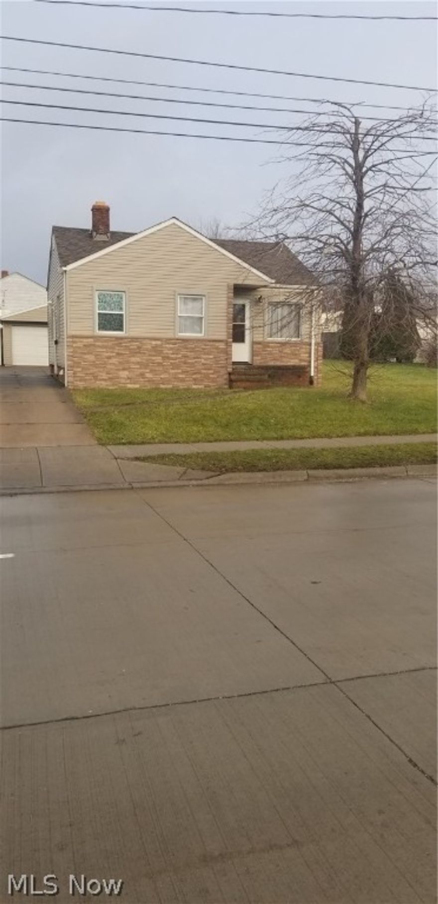 Good investment potential with this cozy ranch that comes with the extra lot of land next to the home! The home could potentially be zoned commercial and the adjacent lot of land converted into a parking lot. Or the homeowner may just want to have this space all to themselves being less than 0.1 miles from shopping centers. The home has a charming feel as you walk in the front door with the popular greys inviting you. This contrasts well with the natural hardwood floors along with newer vinyl flooring in the kitchen. It also has an unfinished, painted basement with laundry area. There is also a 2 car detached garage with a keypad code. The adjacent lot of land is 0.083 acres with 35' of frontage and 103' in depth.