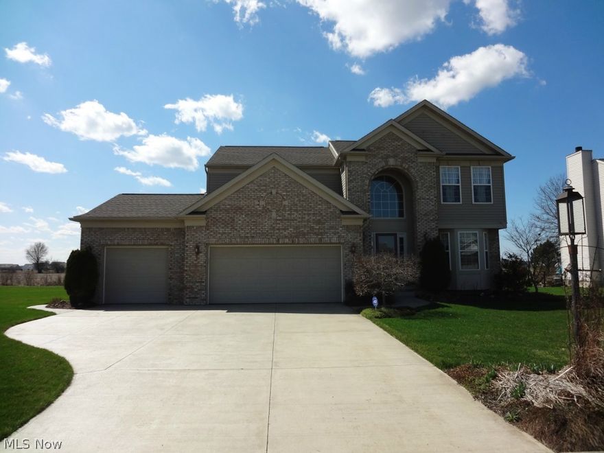 North Ridgeville Brick & Vinyl Colonial Has Loads Of Curb Appeal! Spacious Home With 2020 Square Feet + Full Basement Which Provides Loads Of Extra Square Footage & Storage Space. Step Into Impressive 2 Story Foyer! Spacious Eat-In Kitchen Features Island, Corian Counter Tops, Ceramic Tile Floor With Plenty Of Cabinet Space. Formal Dining Room Is Perfect For Family Dinners. The Great Room Boasts Brick Fireplace With Mantle. Convenient First Floor Laundry Room. All Bathrooms Have Ceramic Tile Flooring. The Master Bedroom Features Walk-In Closet With Glamour Bath! Relax In The Jetted Soaking Tub & Mornings Made Easy With Double Sink Vanity! Enjoy Summer Relaxing On The Vinyl Deck With Concrete Patio All On Oversized 76x169 Lot. There Is A Sprinkler System and 2 Year Old 40 Year Roof! 3 Car Garage Provides Plenty Of Parking! Located Near Shopping, Restaurants & Freeway Access. This Is A Great Place To Call Home!