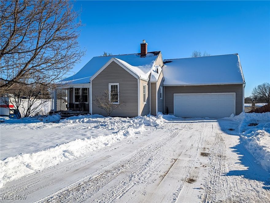 Welcome Home to this pristine Craftsman Style Bungalow. This 2 bedroom 1 bathroom home lives so much bigger than it looks. You will be proud to call this HOME.  All the vintage touches you love but with modern conveniences. Welcome your guests onto the quaint front porch and into the living room. Immediately you will see and understand the quality of this home. Custom mill work molding, glass door knobs, beautiful original wood doors and hardwood floors are just a few of the details. Style specific and warm carpet in the living room add comfort and warmth. Custom Blinds and arched doorways are sure to make you proud. Sitting conveniently at the end of the hallway and living room are a newly updated bathroom and a nicely sized bedroom. The bathroom has new LVP, and custom smoked glass shower door and gold faucets that you'll just adore. Just off the living room is the kitchen. Updated cupboards, stainless steel appliances and a center Island, makes this kitchen a great place to cook and entertain. The light filled dining room is just a few steps away. You will love the 2 original built in corner hutches. Upstairs to the 2nd level is a very large bedroom. Again you will see custom millwork molding and beautiful light fixtures. Unfinished, very clean basement is just waiting for you to create that home gym, craft space or hang out area. The 2.5 car attached garage is great for the Ohio weather, complete with utility sink w/hot and cold water, and door to the backyard. Get ready for barbecues! Or just a private space to sip your morning coffee on this nice sized and PRIVATE composite deck that will give you peace of mind for years to come. The large back yard with shed to store all your lawn care items and keep the garage for storing your cars. Concrete driveway, neutral vinyl siding, Windows (2012) with lifetime transferrable warranty; Roof (2018) Basement wall strapping (2024) with limited lifetime transferable warranty. NEW HWT Tank 2025. Nothing to do but move in!