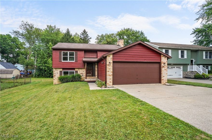 Not your usual bilevel!  This beautifully renovated home on a conveniently located cul de sac is a must see.  The warm, lovely décor is accented by beautiful flooring and neutral colors and a bright and airy feel.  A wood burning fireplace is the focal point of the great room that opens into the dining area.  Enjoy the kitchen, enhanced by a skylight and featuring modern stainless steel appliances and epoxy countertops.  Down the hall is a renovated full bath with a large, tiled shower.   Rounding out the main floor is the huge primary bedroom with double closets, and plenty of space for a sitting area for those quiet moments of relaxation. Three bedrooms on the lower level or possible den space, depending on your needs. and an additional renovated full bath.  The large utility room includes the washer and dryer and opens up to over 200 additional square feet of living space, looking out at the back yard with lots of natural light.  Currently set up as a 3 season room, but heat could easily be added from the adjoining utility room. The large deck, accessible from the eating area overlooks the backyard, ready for you to enjoy. What a great lot, with .25 acres.  In addition to all the visible renovations, the wiring has been updated throughout and the storm drainage has been improved to include a French drain in the backyard.  So close to Waterworks, easy freeway access, and just minutes away from all of the amenities in downtown Cuyahoga Falls.  Put this on your short list!