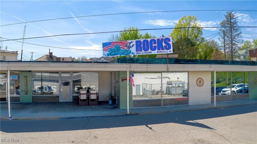 Lots of parking! Lots of square footage in this very well maintained building. 7,162 sq ft to be exact. There are two long standing tenants with well established businesses leasing storefronts. There is another that could be up and in use very quickly...use your imagination. Next find an operating Restaurant with a full service bar just off the rear dining room. All can be closed off for private dinners or meetings. The updates are many. You will find them listed in the documents. The Point of Sale feature tracks for inventory, sales and employee time. Not to mention operates the cameras. There are 4 - 80" big screen TVs and 2 - 27" at the Bar.
To make sure no one is left out there is a 17000 Sq Ft parking lot to hold all of your guests mode of transportation. Come and see us check out the wonderful cuisine and atmosphere...See you soon!