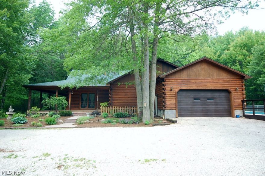 Properties like this just don't come around very often! Check out this awesome 4 bedroom, 2 full bath log home located on 7.57 mostly wooded acres (with a pond)! There is so much to love about this home and land including: PRIVACY, a new roof and freshly stained exterior, city water, a wonderful in-ground swimming pool (heated if you like) with a new liner and new safety cover, wraparound porch, gorgeous great room with floor to ceiling brick fireplace, 1st floor laundry, full basement with 2nd fireplace and direct access to garage, TCHD pre inspected/approved septic system, 40x23 second garage with extra tall door (for boat, RV, etc.) and more! Champion schools and immediate possession! This is one of a kind!