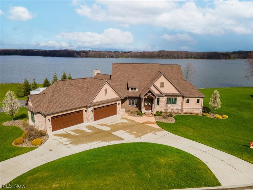 Absolutely SPECTACULAR 4 Bedroom/5 & 12/ Bath Home with 4 Car Garage in Prestigious AVELLINO Development on Pine Lake in South Range Schools.  Home Features Include:  MAGNIFICENT Eat in Kitchen with Granite Countertops, Hardwood Floors, & Thermador Stainless Steel Appliances, HUGE Great Room with wood burning fireplace & cathedral ceilings, Formal Living Room with Gas Fireplace, Formal Dining Room with Cathedral Ceilings, Private Office & Half Bath.  There is also a Spacious First Floor Master Suite with AMAZING Master Bath with Double Sinks, Floor to Ceiling Tile Shower, Soaking Tub, & Large Walk in Closet.  The Second Floor Features 3 Large Bedrooms each with their own Private Baths.  The Lower Level offers a MASSIVE Recreation Room with Kitchen Area, Game Room Area, Full Bath, Storage Room Area, & Family Room Area/or 5th Bedroom.  The Great Room, Living Room, & Master Bedroom all have access to the PHENOMENAL Back Deck with views of AMAZING Pine Lake.  The Lower Level has access to the Back Patio which leads to the Firepit and Scenic, Peaceful Backyard.