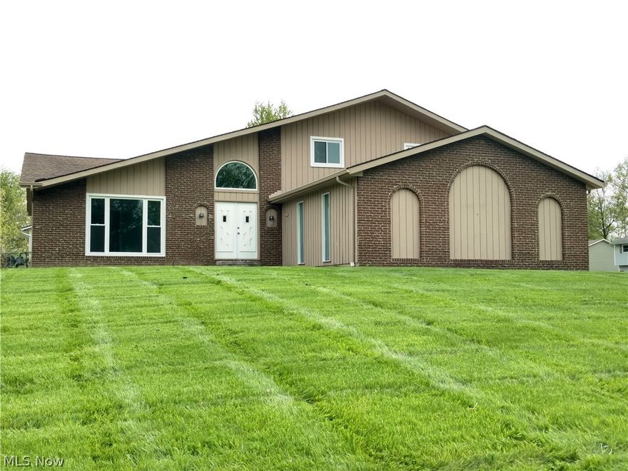 Another Amazing 4 bedroom Split-Level with 2.5 baths and a two-car attached garage.  This home has been retooled from top to bottom.  A kitchen that was made for entertaining and cooking.  No need to worry about the heavy pasta pot in this kitchen.  Just fill it right on the stove with the convenient back wall water faucet.  Enjoy the warm grey tones throughout the home and enjoy all of the new items that include all flooring, counters, countertops, cabinets, opened walls to offer more natural lighting and practical use. Please notice the custom winding staircase banister and railings.  Full wall stone fireplace in the living room will be great for those winter nights.  And I am sure that the first-floor laundry room will be an enjoyable feature.   Plenty of room to expand in the unfinished full basement.  This could certainly take the 2100 square feet of living to a whole new level.  Seller is offering a premium one year home warranty.