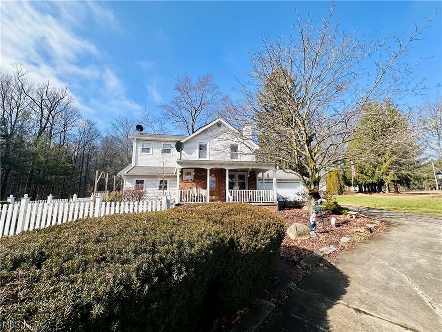 You'll find your own personal paradise on this sprawling two acre property with charming brick walkways, fenced garden, deck, pavilion, basketball court and scenic views from every angle. The turn-around driveway provides easy entry to the oversized two car attached garage with a rear garage door for quick backyard access. From the moment you enter this house, you're greeted by an array of classical architectural details such as wood floors, brick fireplace, arched doorways, intricate moldings and wood beams. All add to the charm and character of this wonderful residence. The generous living space includes a formal living and dining rooms, den, kitchen with appliances, informal dining area and full bathroom. The star of this level, however, is the expansive step-down family room addition showcasing a cathedral ceiling, skylights, walls of windows, fantastic second floor loft and stunning views of the property. Imagine the parties you could host in this space! The second floor provides a large primary bedroom with his & hers closets, plus two guest bedrooms, full bath and access to the loft. This home features plentiful storage throughout including a basement, large laundry/mud room off of the garage and attached storage shed to keep your belongings safe and well-organized. This property will exceed your expectations. Schedule a private tour today!