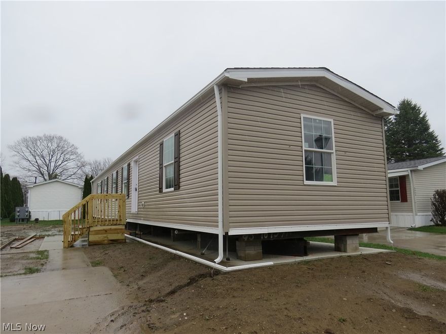 Brand new manufactured home offering 3 bedrooms, 2 full bathrooms, and 1,140 sq ft of comfortable living space. The carpeted primary bedroom features a ceiling fan, walk-in closet, and private bath with walk-in shower. Open concept floor plan. The kitchen is well appointed with two pantry cabinets, an island with sink, and a stainless steel appliance package including electric range, refrigerator, microwave, and dishwasher. Thoughtfully designed layout with modern finishes throughout. Home includes a drape package and 2” mini blinds for added convenience.