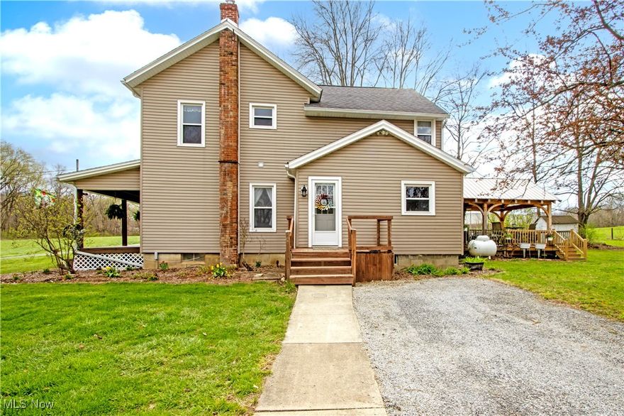 Priced to Sell! This beautifully maintained farmhouse is nestled on a stunning 31.50-acre mini farm, offering peace, privacy, and a true country lifestyle. Enjoy a fully remodeled kitchen featuring new base cabinets, countertops, tile backsplash, flooring, and all new appliances. The first-floor half bath has been thoughtfully updated into a full bath adding convenience and functionality. Featuring 4 bedrooms and 2 full baths, the home boasts gorgeous hardwood floors throughout, a cozy living room with fireplace, and a dedicated first-floor office. Additional upgrades include new siding, gutters with leaf guards and new windows throughout the home. Enjoy outdoor entertaining on the covered deck, around the fire pit, or explore the many trails added through the woods-perfect for hiking or ATV rides. Outbuildings include a 36x24 two-car detached garage with an attached shop, and a 50x34 barn with water access ideal for hobby farming or livestock. Approximately 3 acres are fenced for pasture and former cornfields have been transformed into productive hayfields. Enjoy farm-to-table living with a large garden surrounded by deer-deterrent fencing and a thriving orchard with apples, peaches, cherries, strawberries, raspberries, blackberries, blueberries and elderberries. This property is enrolled in CAUV with an active timber and forestry plan in place, offering future income potential from select timber harvesting. This is a rare opportunity to own a turnkey hobby farm with income potential, endless outdoor activities, and a move-in ready home. Schedule your showing today!