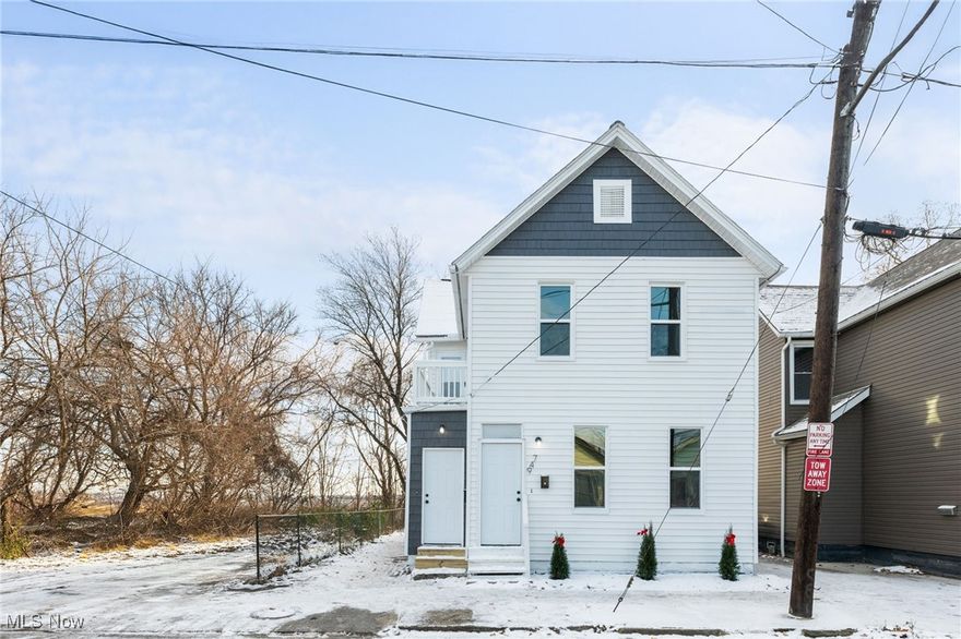 Incredible Opportunity in the Heart of Tremont! Don’t miss this fully renovated two-family home, ideally located near Tremont, Ohio City, and all the attractions of Downtown Cleveland. Whether you’re looking to live in one unit while renting the other or expand your investment portfolio, this property checks every box. Each unit offers a bright and spacious living room that seamlessly flows into a modern kitchen, complete with sleek white cabinets accented by black hardware, granite countertops, and stainless steel appliances—all included. The first-floor unit features an owner's bedroom with a closet, a second versatile room perfect as a second bedroom or office, and a beautifully updated bathroom with a double-sink vanity, ample storage, a walk-in shower, and stylish black hardware. The second-floor unit includes a cozy bedroom and an equally stunning bathroom with the same luxurious features. Both units come with a stackable washer and dryer for added convenience. The lower level provides plenty of storage space. Recent updates include brand-new windows (including a glass block in the basement), all-new electrical systems with updated wiring, panels, outlets, and lighting, and completely updated plumbing with new supply and waste lines. The home also boasts new drywall, flooring, and soft-close kitchen cabinets with granite countertops and stainless steel appliances. Bathrooms have been updated with tiled showers, glass surrounds, and double vanities. Exterior improvements include fresh paint, partial new vinyl shake siding, and new HVAC systems with updated ductwork 2024. This home is truly move-in ready—just turn the key and make it yours! Don’t wait—call us today to schedule your private showing! The owner is a licensed agent in the state of Ohio