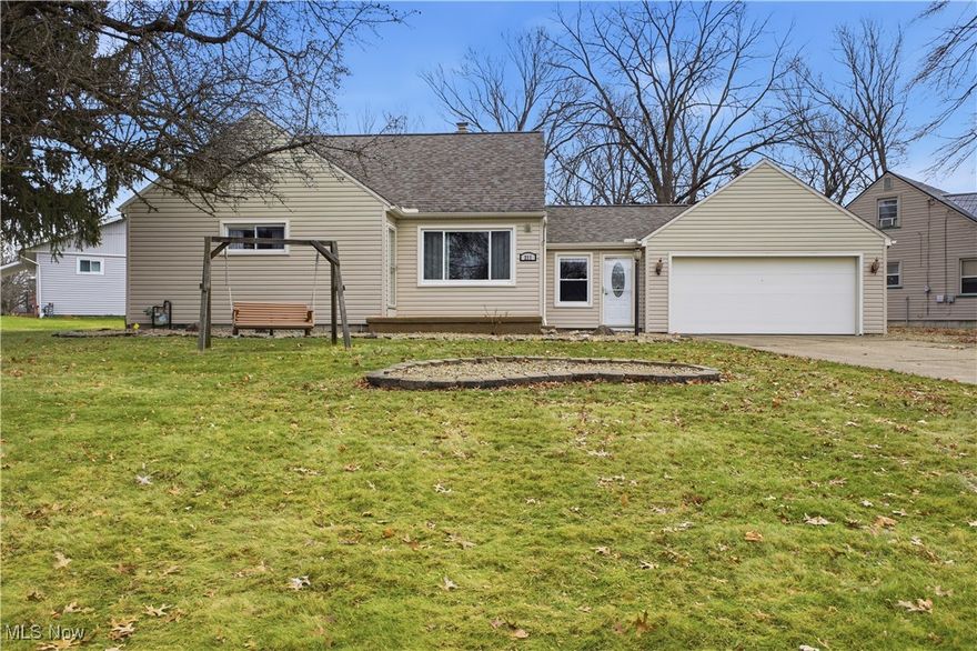 Welcome to 211 Aldrich Road, a move in ready Cape Cod in Austintown that simply works. From the moment you walk in, the layout feels comfortable, practical, and designed for everyday living. The main level offers a bright living room that welcomes you home and flows naturally into the updated kitchen. With new appliances and clean finishes, the kitchen is both functional and inviting, whether you are making a quick meal or hosting friends. Two bedrooms and a full bathroom on the main floor provide flexibility for one floor living, guest space, or a home office. Upstairs, the large third bedroom feels like a private retreat with plenty of room to spread out, relax, or create a dedicated workspace. It offers the kind of separation that makes the layout feel larger than expected. The breezeway connecting the house to the attached two car garage is one of those features you quickly come to appreciate. It works perfectly as a drop zone, mudroom, or bonus flex space and helps keep everyday life organized as you come and go. The garage also includes additional built on storage, giving you extra room for tools, hobbies, or seasonal items.
The partially finished basement adds even more usable space, along with the convenience of an additional toilet. Whether you envision a rec room, workout area, or casual hangout, this level offers flexibility while still allowing for plenty of storage. Outside, the spacious yard is ready to enjoy with a patio, fire pit, shed, and chain link fence, making it ideal for pets, gatherings, and relaxed evenings at home. Fresh paint, new carpeting and a true move in ready condition make this home an easy choice. Conveniently located near shopping, dining, schools, and major routes, this property offers space, updates, and location in one well rounded package. Do not miss your chance to make this one yours.