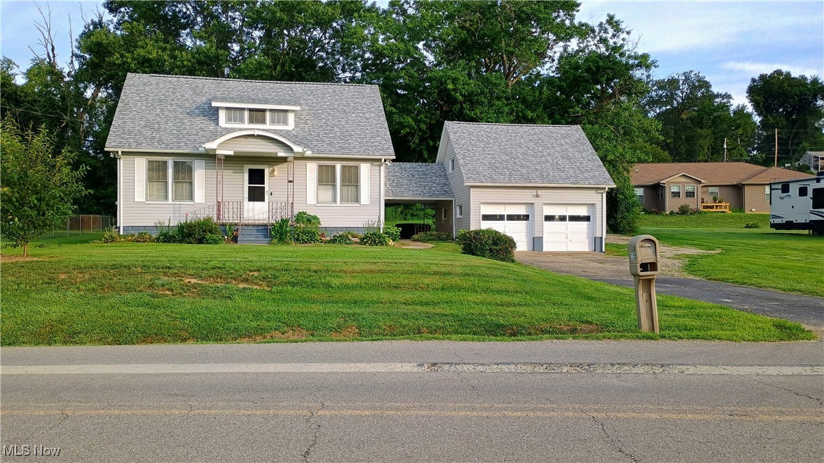 Come and see your new home. Conveniently located close to Rt. 70, Rt. 40, Northpoint Dr. and downtown. Easy access to Columbus and surrounding areas. Nice two car garage and also a carport and additional parking in Back. One bedroom on the first floor and two more plus a room for an office or another bedroom on the second floor. Full bath on the first floor and a half bath on the second floor.Vinyl siding and roof shingles new in 2022. All the carpet is new upstairs and down. Public sewer is currently being run in the area. No cost for the tap but new buyer will be responsible for the cost to hook up. West Muskingum School District.