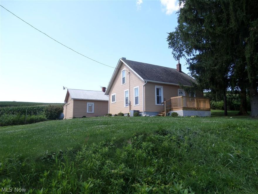 Country Living with the convenience of a main road. This home features a first floor laundry and bath. Everything is like new here with so many updates, which include windows, central air, kitchen cabinets, bathroom. Outside you will find an extra large workshop 13x22 and a garage.