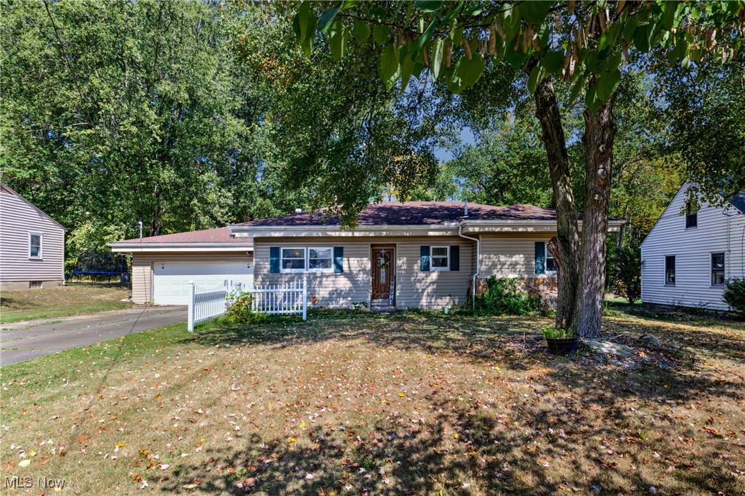 Welcome to this cozy 2 bedroom ranch home with fenced in backyard in Howland schools! Walk in front door to spacious foyer or sitting area then proceed to open living room area with new flooring, gas fireplace and with doors to private fenced in back yard and covered patio with hot tub for outdoor entertainment. Off of the living room is an updated eat in kitchen and then a laundry/mudroom that leads to attached garage. Roof and windows approx 8-10 years old. Updated flooring and new fence in past few years. Schedule your private tour today!