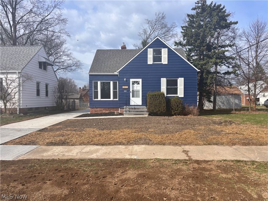 Explore this gem of a three-bedroom cape cod nestled in picturesque Euclid, Ohio. Known as the charming lakefront city, this home is a stone's throw away from the serene Lake Erie, inviting beaches, and the sprawling Cleveland Metroparks. Beyond the welcoming facade lies a tastefully updated interior, boasting an open kitchen adorned with Shaker Style cabinets, a striking custom-designed backsplash, stainless steel appliances, and sleek waterfall flooring. Entering the dining room, become captivated by the sliding patio doors leading to a freshly constructed deck, creating the perfect space for summer hangouts. The living and dining areas showcase the original hardwood floors that flow seamlessly into the spacious main-floor bedrooms. Each one fitted with energy-efficient vinyl windows. Ascend to the  third bedroom to discover a generously sized space complemented by plush carpeting awaiting your personal touch. Additional upgrades include a all new concrete driveway, a second full bath in the now partially finished basement, a new hot water tank, and some updated electrical & plumbing. Ensuring peace of mind, this home comes violation-free and with a 1-year home warranty. Don't get caught out in the cold - stop what you're doing and schedule your showing today!