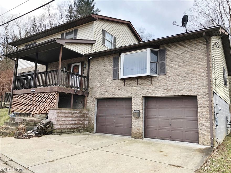 Very large 2 story home in Martins Ferry. This 1991 home features 3 beds and 3 baths. With 2464 square feet, you will have plenty of room. First floor laundry, large eat-in kitchen, pantry, living room, family room, bathroom are found on the first floor. The family room could easily be converted into a large first floor bedroom. The pantry could also be converted to a home office. The second floor features the master suite, 2 more bedrooms, and the third bathroom. Partially covered deck of the back of the house. Back yard features chain link fence. Two car basement garage. Dumbwaiter from garage to kitchen will save on carrying items up the steps.