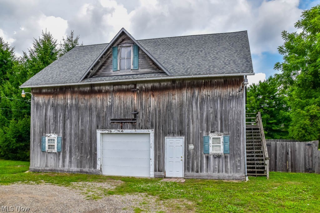 What an opportunity! This 42x31 barn/garage is the perfect set up for those needing storage, a workshop or hobby shop! This building has updated electric, gas with a heater and concrete floors. Two rooms on first floor that are 29x30 and 11x27. Upstairs has a large 42x31 storage area with an additional entrance from the exterior as well. Water and sewer available at street. Buildings like this are extremely hard to find! Great location and tons of opportunity with this building!