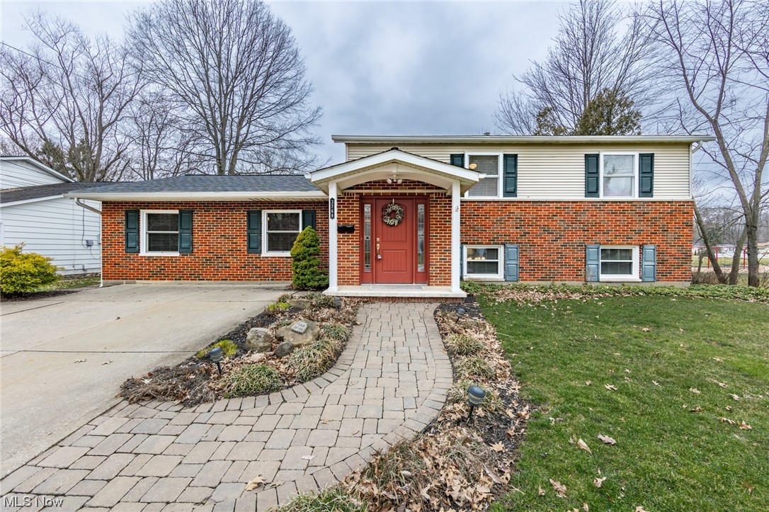 A wonderful, one of a kind 4 bedroom, 2 full bath split level with a walk out lower level in Stow. This excellent home has an updated, and large eat-in kitchen with granite counter tops and stainless steel appliances. The large living room is shared with a dining area. The main level family room is 24x12 with a fireplace. A master suite has a huge bathroom with a garden tub, shower, and double sinks... and connects to a walk in closet that will shock you. There are 2 bedrooms on the main level. A large attached shed is heated as well. The many updates include a new furnace in 2023, water tank in '22, updated electric panel, and more. There is a large composite deck off the master, a brick patio, a large yard, and is next to Northport Park.