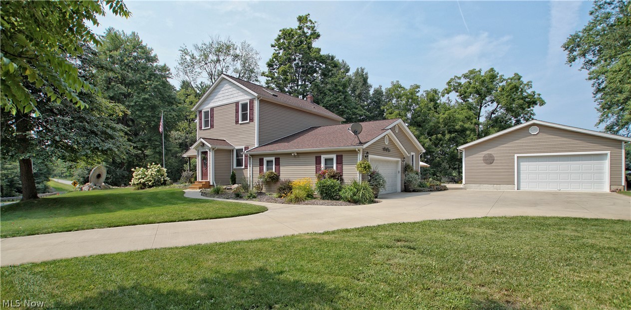You'll love this beautifully landscaped home on 2+acres! Huge eat-in kitchen with granite counters and breakfast bar, soft close cabinets, appliances and hardwood floors that lead to the large great room with wood burning fireplace and area perfect for formal dining. Vaulted first floor master with glamour bath, large tiled double shower and soaking tub. 2 large vaulted bedrooms upstairs with updated bath with granite dual sinks/vanity. First Floor laundry is a great convenience. 2 car attached garage and rear 3 car detached with enclosed porch, gas well on property. 1 year home warranty included, don't miss this amazing home.