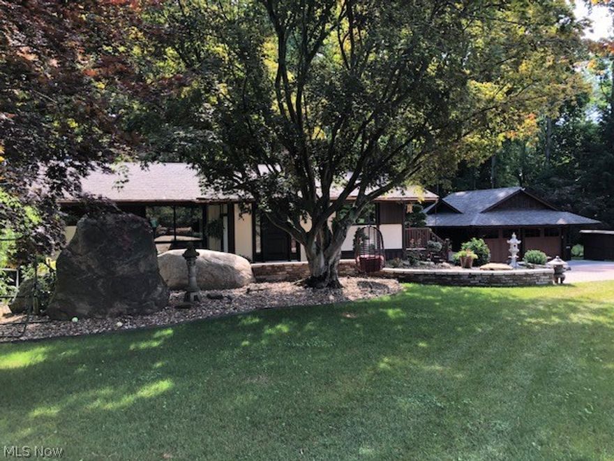 Beautiful, unique, custom 3 bedroom, 2 full bath ranch in the Revere School District. This home is all updated and redone in and out.  Nice welcoming foyer with closets.  Eat in kitchen with granite counter tops, sitting bench, and unique wood beams.  Large tile great room with lots of windows overlooking breathtaking back yard.  2 bedrooms with nice wood floors.  Large full bath with walk in shower.  Walk out lower level with laundry, office, family room, rec/exercise room, and master bedroom with full size bath.  Walk out to beautiful back yard.  3 tier deck leads to custom patio with large fire pit.  Driveway is all pavers.  Part ownership of community lake and pavilion.